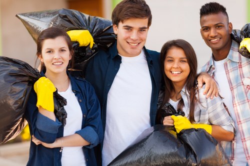 Workers sorting construction debris for recycling